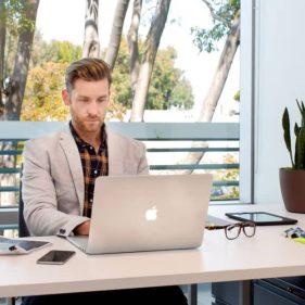 Smart person using laptop on a desk